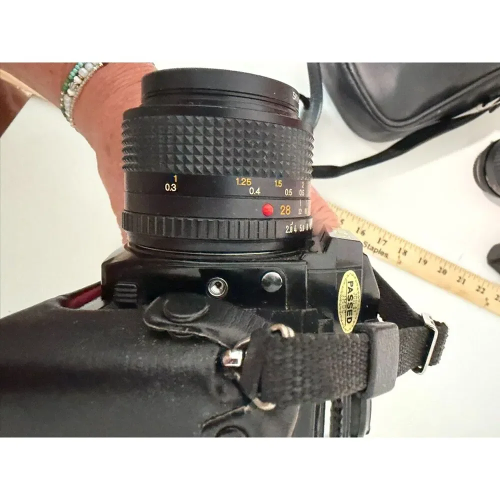 Minolta X-700 with accessories and carry case.